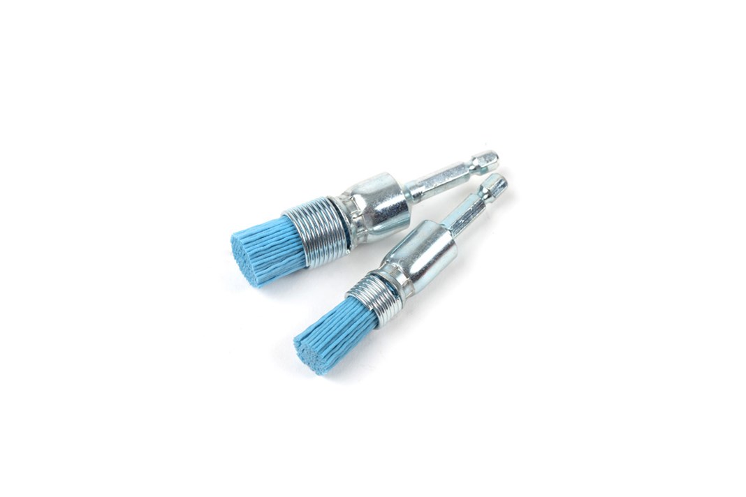 Silicone-nylon brushes for injector seat